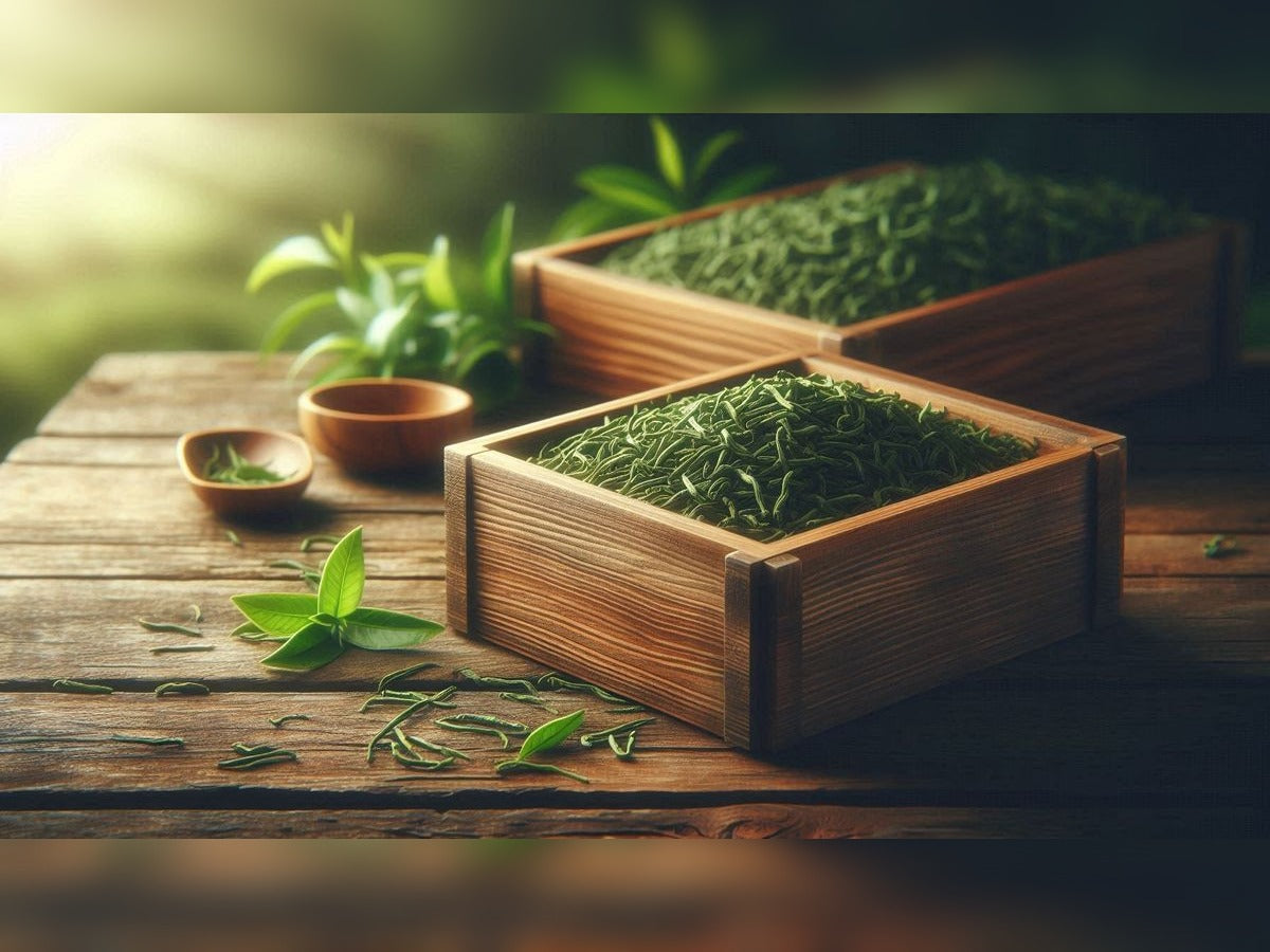 Wooden containers filled with green tea on a wooden table with a blurred natural background