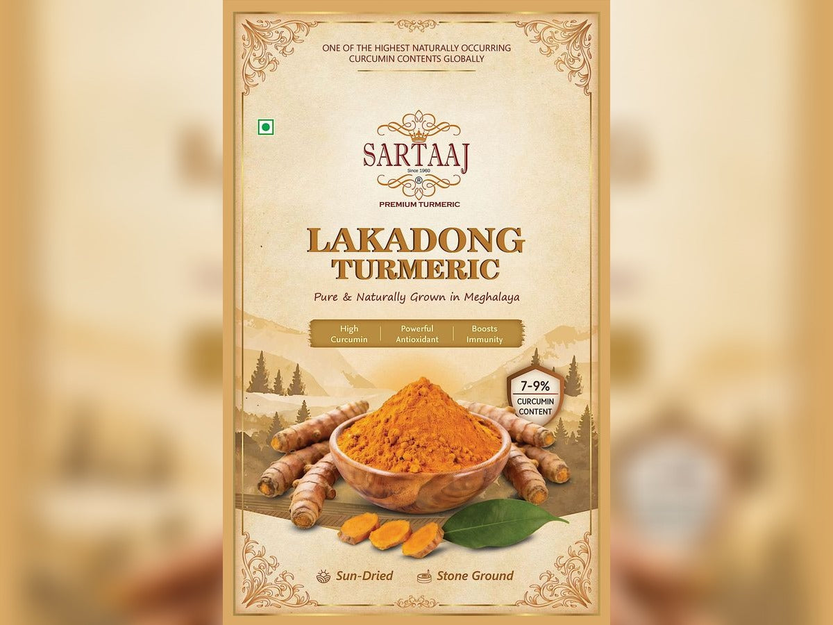 Sartaaj Lakadong Turmeric packaging with turmeric roots and powder on a beige background