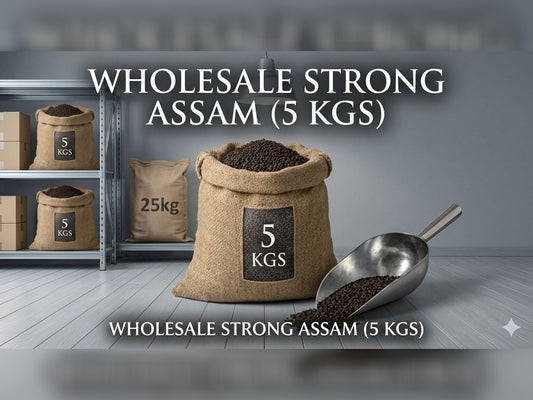 Sack of wholesale strong Assam tea with a scoop on a wooden floor.